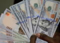 Naira slumps to 452/$ as speculations, debt weaken market